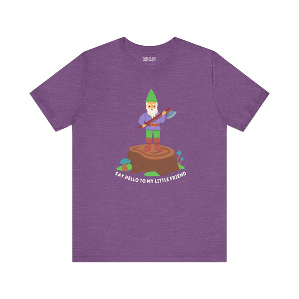 Purple soft tee featuring a gnome with an axe, saying 'Say hello to my little friend' on a stump.