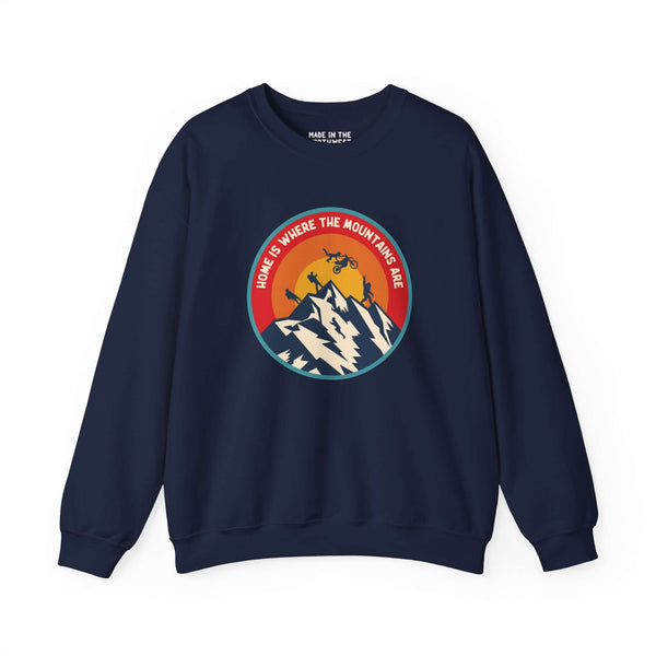 "Home is Where the Mountains Are sweatshirt with PNW design featuring hiking, motocross, and Bigfoot on a navy background"