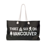 Three Six Oh Roots Vancouver Weekender Bag featuring axe, sasquatch, and tree design for adventures.