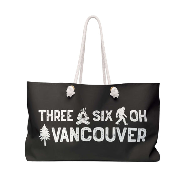 Three Six Oh Roots Vancouver Weekender Bag featuring axe, sasquatch, and tree design for adventures.