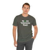 Man wearing Dope Oregon Dad soft tee featuring a marijuana leaf in the 'O', celebrating Oregon style.