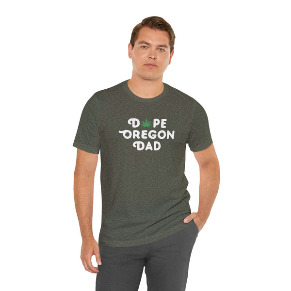 Man wearing Dope Oregon Dad soft tee featuring a marijuana leaf in the 'O', celebrating Oregon style.