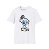 White tee featuring a playful pickleball character with the caption 