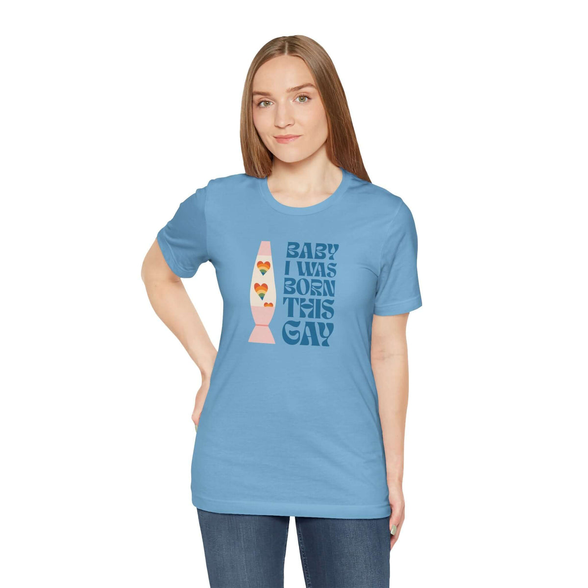 Model wearing Baby I Was Born This Gay soft tee in light blue, celebrating identity with vibrant colors and fun design.
