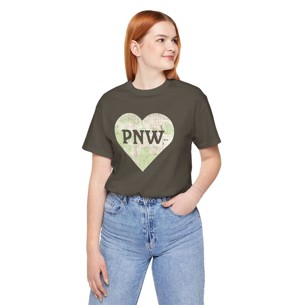 Woman wearing a PNW Explorer's Heart Soft Tee with topo map heart design, emphasizing love for the Pacific Northwest.