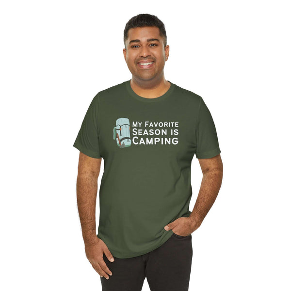 Man wearing a green tee with the text 'My Favorite Season is Camping' and a backpack graphic.