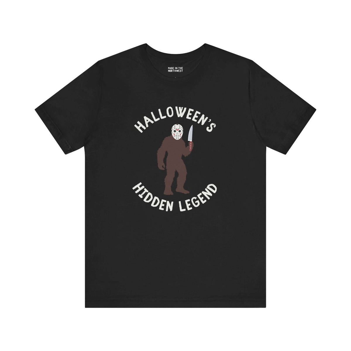 Halloween's Hidden Legend Bigfoot tee featuring a creature with a knife, blending horror and Northwest mystery.