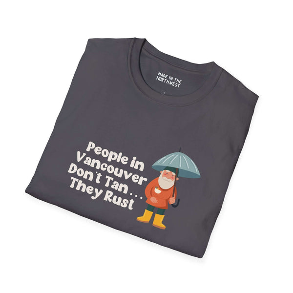 Gray softstyle t-shirt with gnome using an umbrella and text: 'People in Vancouver Don't Tan, They Rust'.