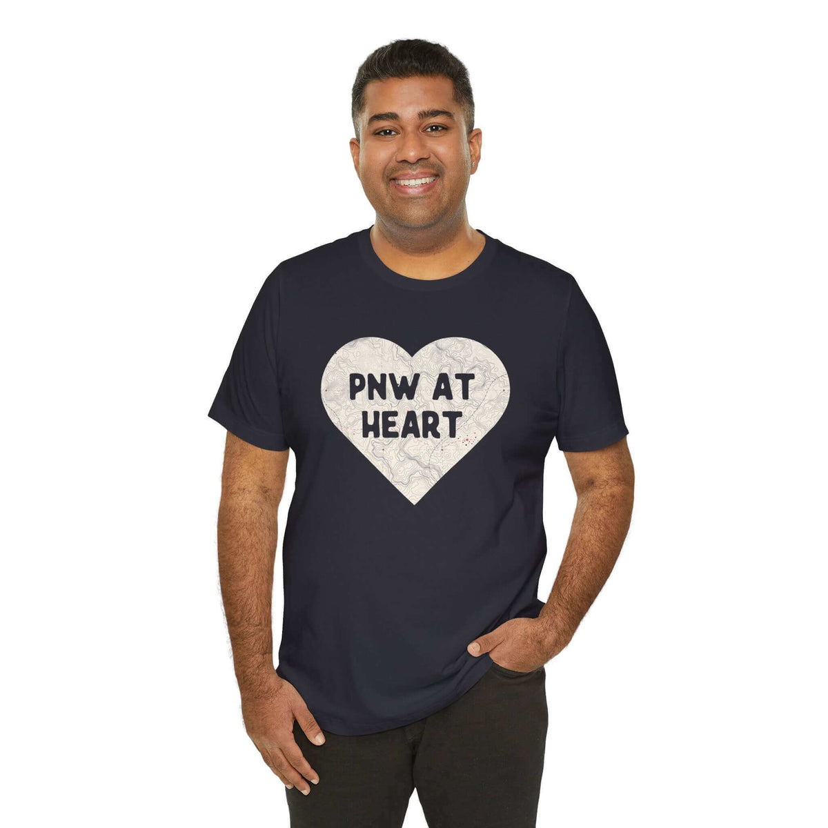 Man wearing black "Heart of the PNW" map print tee with "PNW at Heart" message, expressing Pacific Northwest pride.