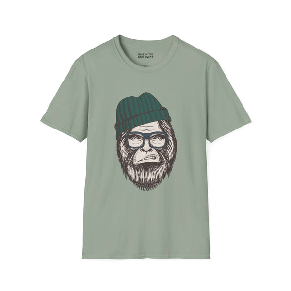 Hipster Squatch unisex softstyle t-shirt featuring Sasquatch with a beanie and glasses on a mint green fabric.