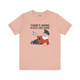 Soft peach tee featuring a whimsical gnome with the phrase 'There's Gnome Place Like Home' for cozy vibes.