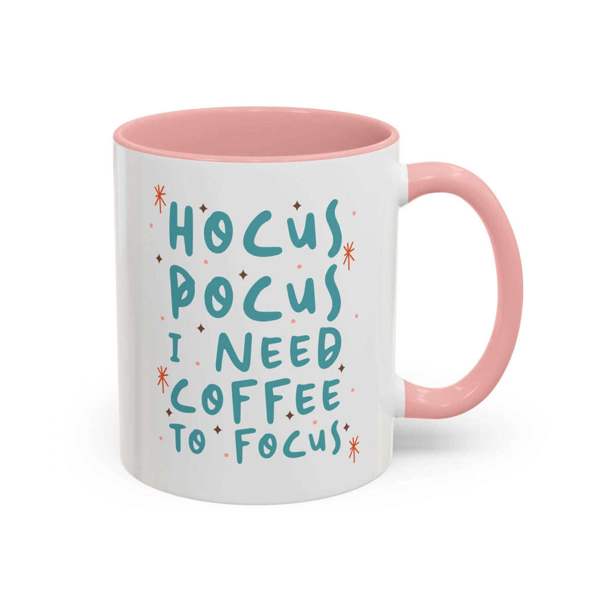Hocus Pocus I Need Coffee To Focus Mug with colorful lettering and a pink handle.