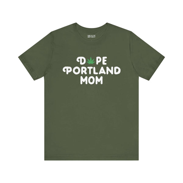 Green tee with "Dope Portland Mom" printed, featuring a marijuana leaf as the "O" in "Dope," celebrating Portland's laid-back style.