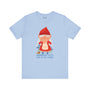 Light blue tee with a cute female gnome and 'Gnomebody Puts Baby in the Corner' text, adding whimsical charm and humor.