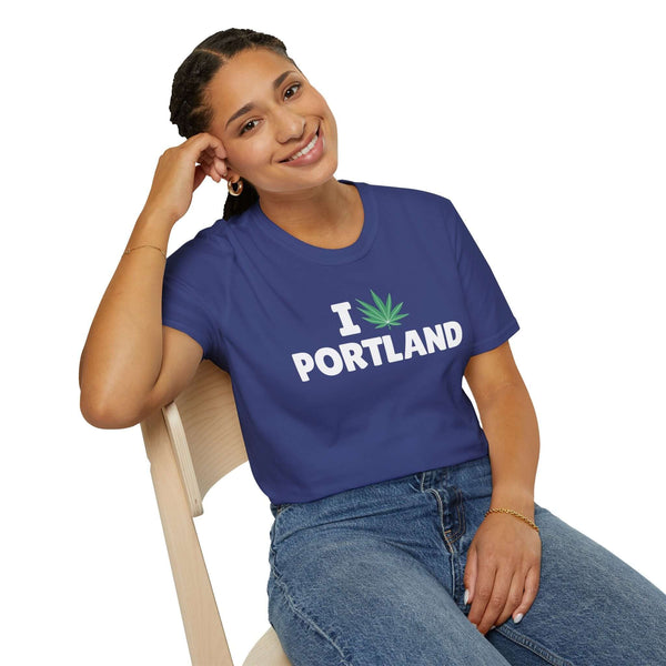 I Marijuana Portland T Shirt on a smiling woman sitting in a chair, showcasing the fun and relaxed Portland vibe.