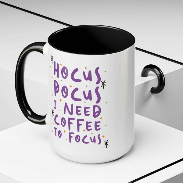Hocus Pocus I Need Coffee To Focus mug with whimsical lettering and starbursts, perfect for morning coffee.