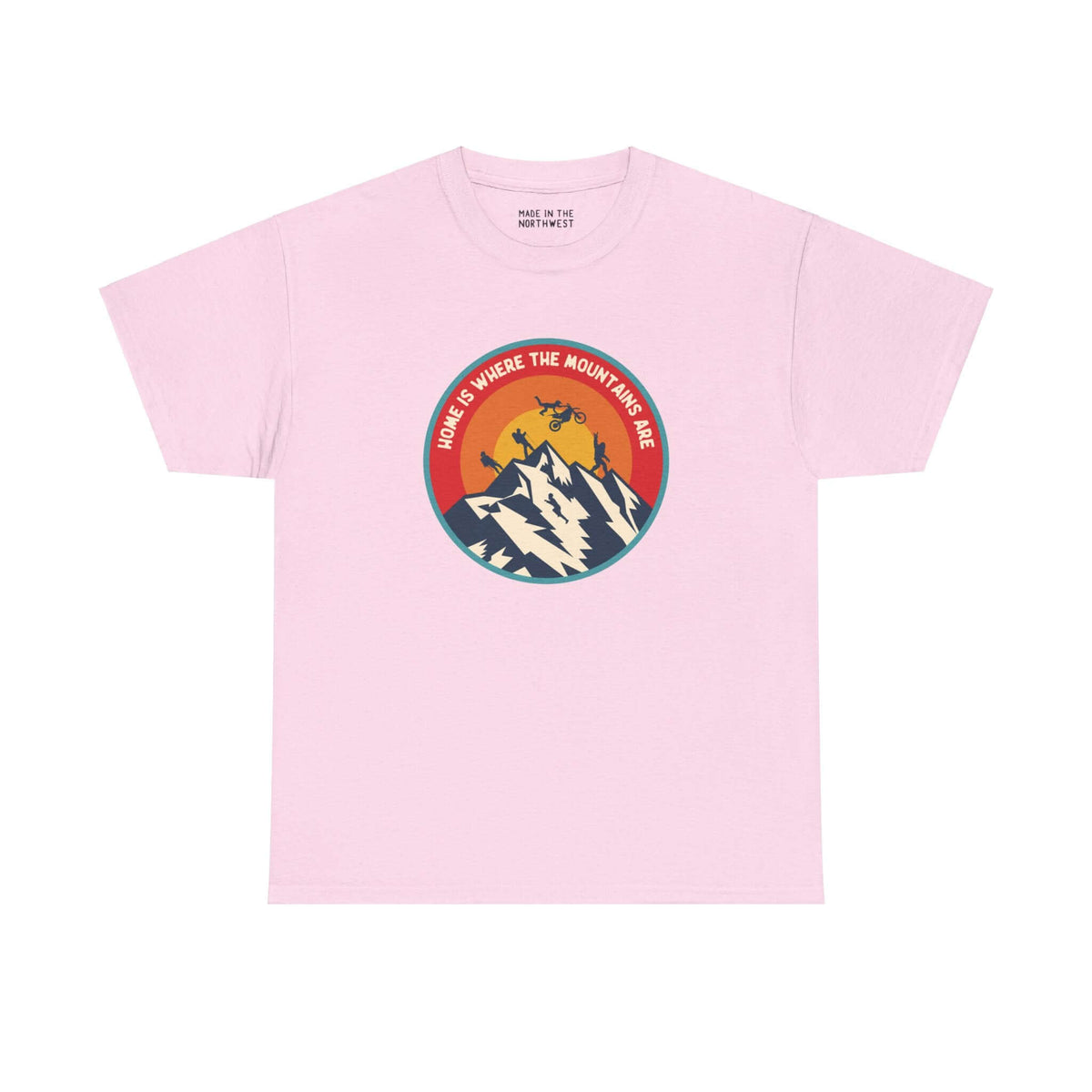 Pink "Home is Where the Mountains Are" tee with PNW activities design, featuring hiking, motocross, and Bigfoot in a colorful circle.