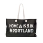 Home is in Portland Weekender Bag with campfire, Bigfoot and tree icons, perfect for weekend adventures.