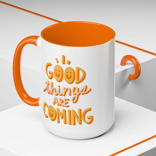 Good Things Are Coming Mug with cheerful design, orange handle and interior, perfect for brightening mornings.