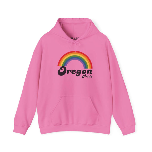 Pink hoodie featuring rainbow design with 'Oregon Pride' text, celebrating inclusivity and love.