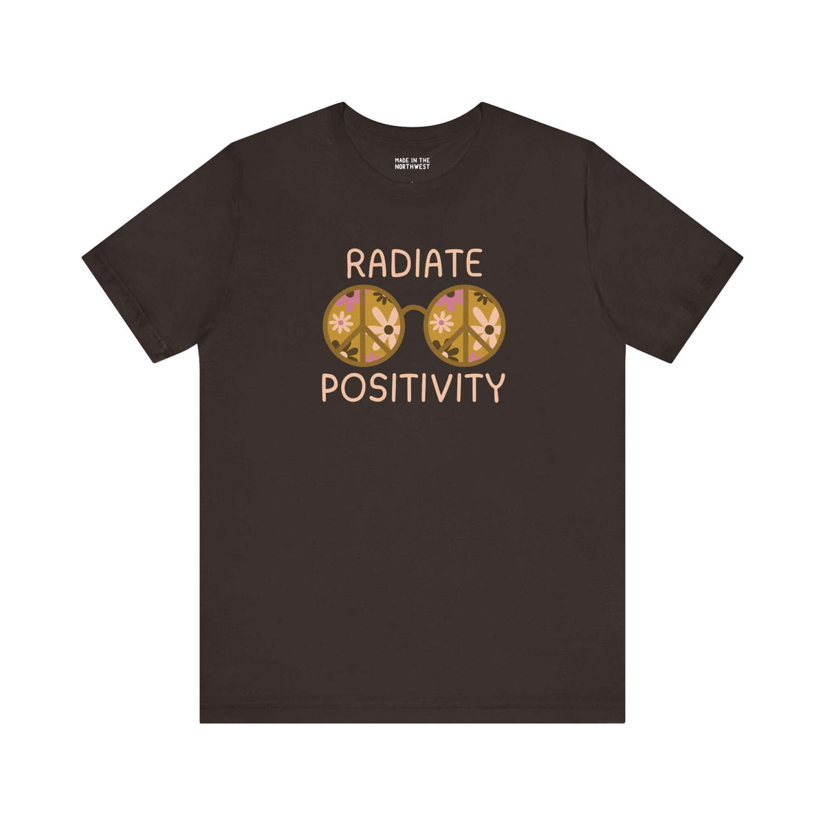 Black premium soft tee featuring 'Radiate Positivity' design with vibrant floral glasses for a feel-good vibe.
