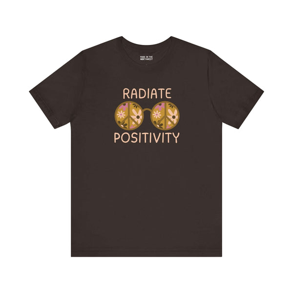 Black premium soft tee featuring 'Radiate Positivity' design with vibrant floral glasses for a feel-good vibe.