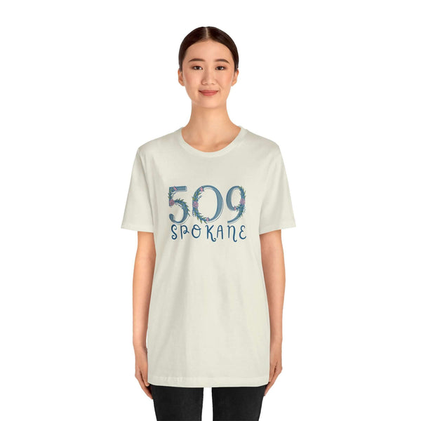 Woman wearing a 509 Floral Area Code Premium Soft Tee in light color, showcasing PNW pride and style.