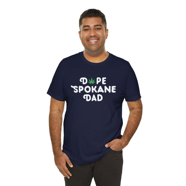 Man wearing "Dope Spokane Dad" tee with marijuana leaf design, perfect for cool dads in Washington state.