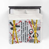 The Crime Scene Snuggle Lightweight Blanket for True Crime Lovers featuring crime scene tape and splatter design.