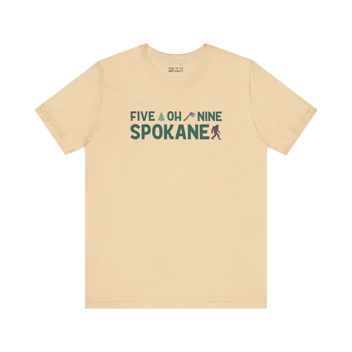 "Five Oh Nine Roots Soft Tee with Spokane design, featuring text and small axe and tree, celebrating Spokane pride and local charm."