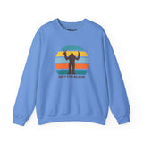 Don't Stop Believin' Bigfoot sweatshirt featuring a playful sasquatch graphic and colorful retro design.