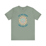Do No Harm, Take No Sh!t premium soft tee with peace flower design on olive green background.