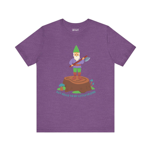 Purple tee featuring a gnome on a stump with an axe, captioned 'Say hello to my little friend', blending humor with bold style.