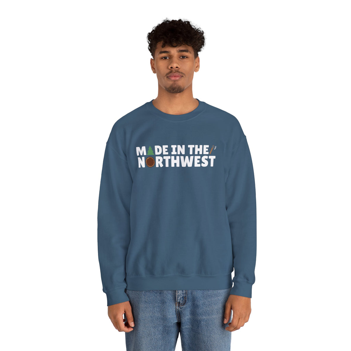 Model wearing a cozy blue sweatshirt that says 'Made in the Northwest', perfect for nature lovers and PNW fans.