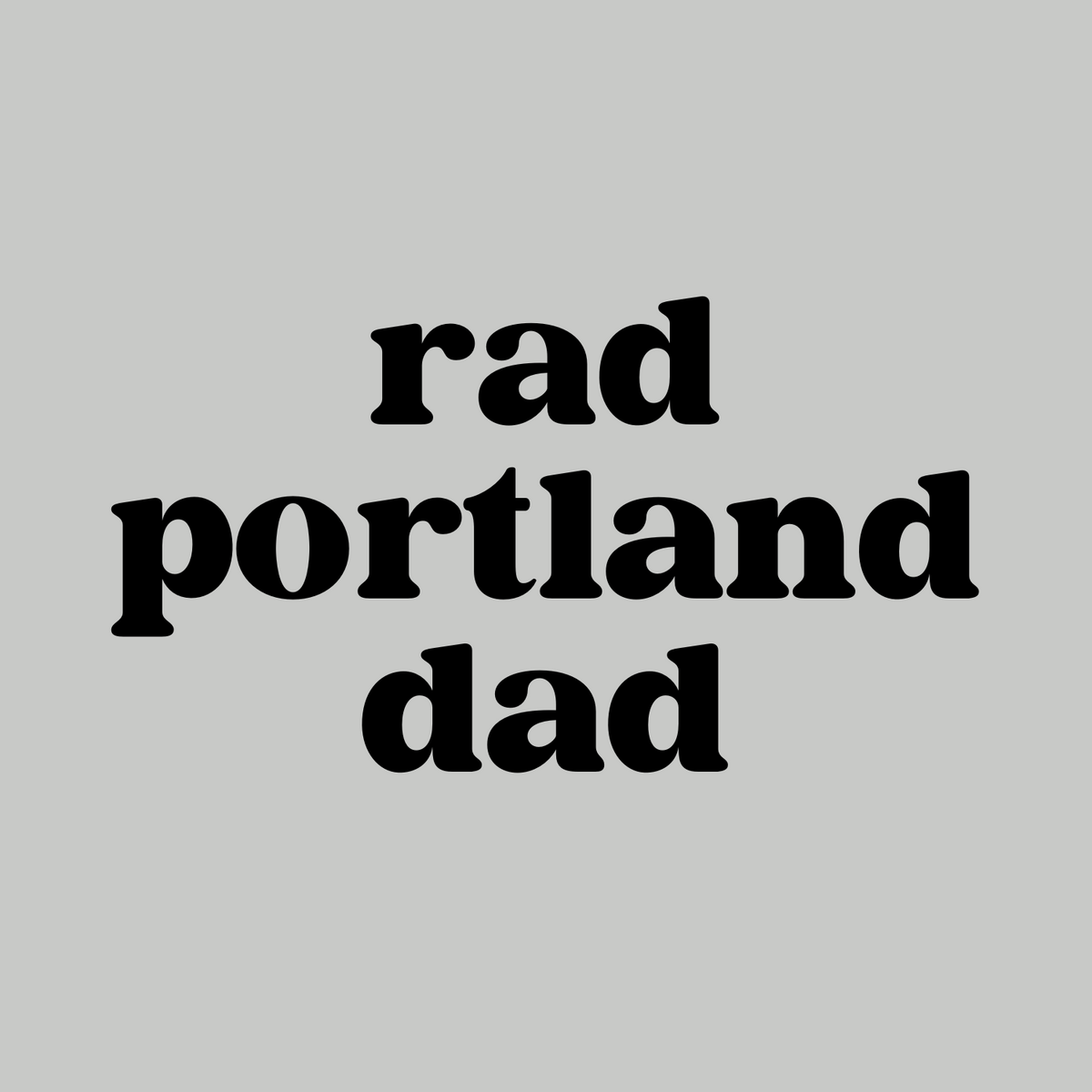 Black text design of 'Rad Portland Dad' on a gray background, perfect for local dads who embrace Portland culture.