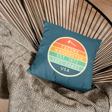 Left Coast Retro Tacoma Washington Square Accent Pillow on a stylish chair, showcasing Tacoma charm and vintage design.