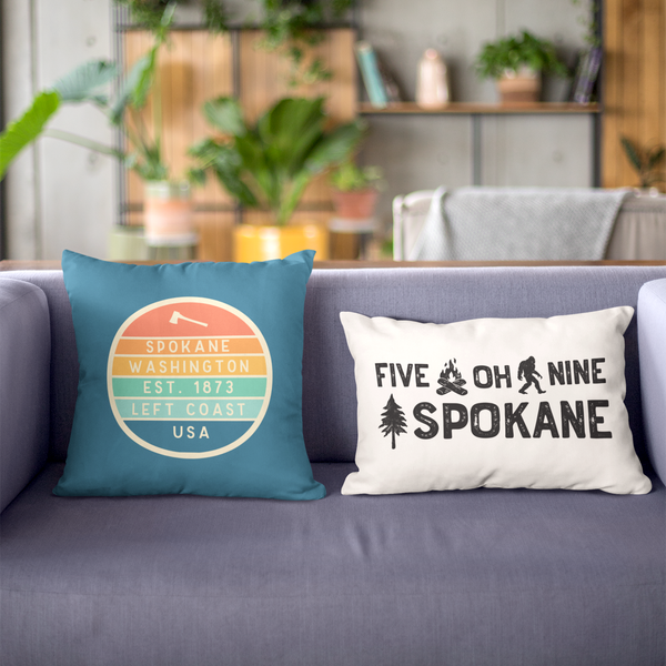 Left Coast Retro Spokane Washington Square Accent Pillow showcasing vibrant designs on stylish couch.