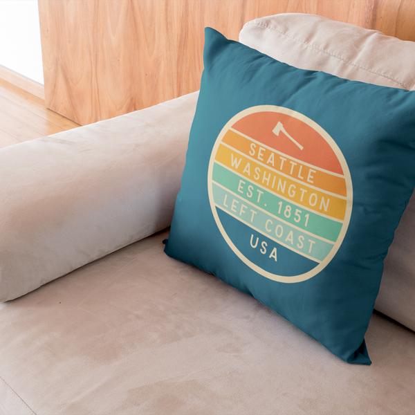 Left Coast Retro Seattle Washington Square Accent Pillow on a cozy couch, showcasing Seattle pride with retro design.