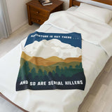 Adventure Is Out There and So Are Serial Killers Lightweight Cozy Blanket on a bed with a scenic design.