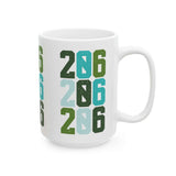 Two-Oh-Six Pop Seattle ceramic mug featuring vibrant 206 design in stacked numbers, perfect for coffee lovers.