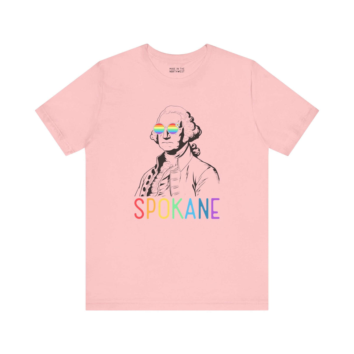 Pink t-shirt with "Spokane" in rainbow letters and line art of George Washington wearing rainbow glasses.