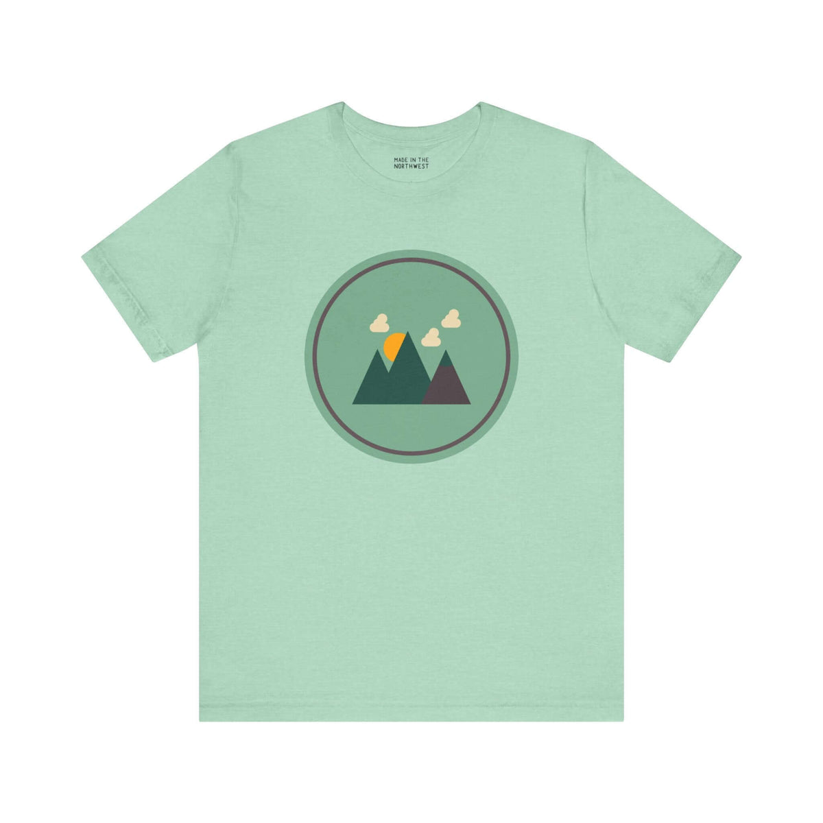 Minimalist forest-themed soft tee in northwest style with simple mountain graphic on a light green background. Perfect for nature lovers.