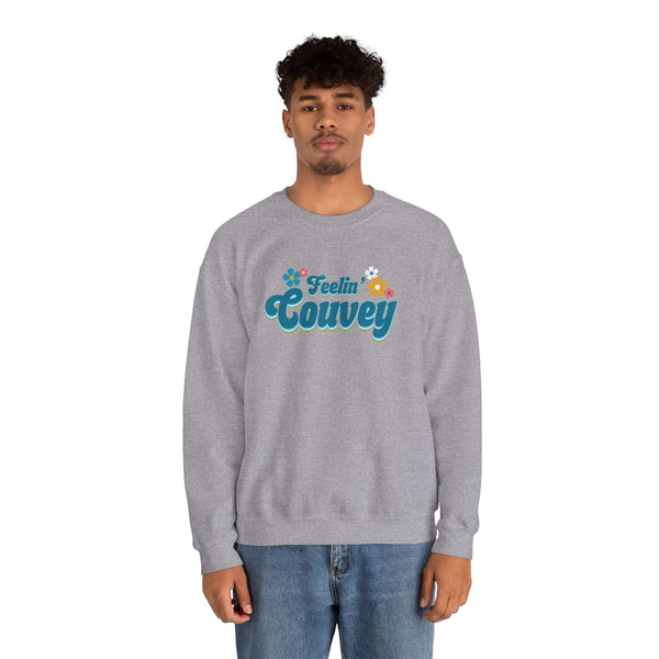 Man wearing a grey Feelin' Couvey retro sweatshirt celebrating Vancouver's spirit.