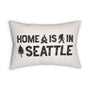 Home is in Seattle Lumbar Accent Pillow featuring bold lettering and campfire, sasquatch, and tree designs.
