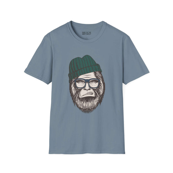 Hipster Squatch unisex softstyle t-shirt featuring Sasquatch with beanie and glasses on a blue background.