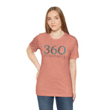 Woman wearing a coral 360 Floral Area Code Premium Soft Tee showcasing Vancouver pride.