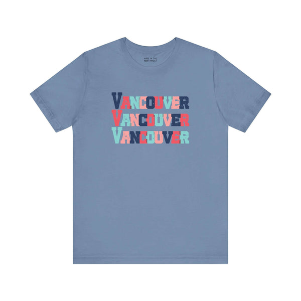 Vancouver trio design tee in blue with bold, colorful block letters, perfect for adding vibrant style and city pride to your wardrobe.