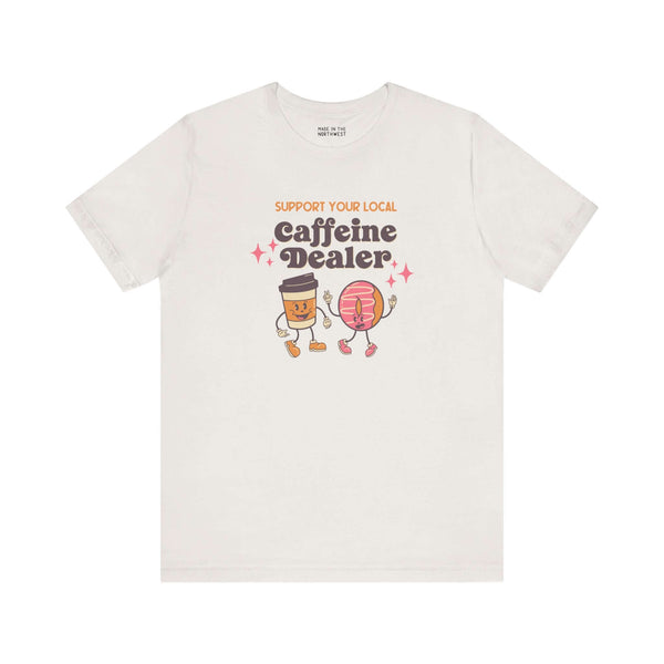 Funny coffee-themed soft tee featuring cartoon characters with text: Support Your Local Caffeine Dealer.