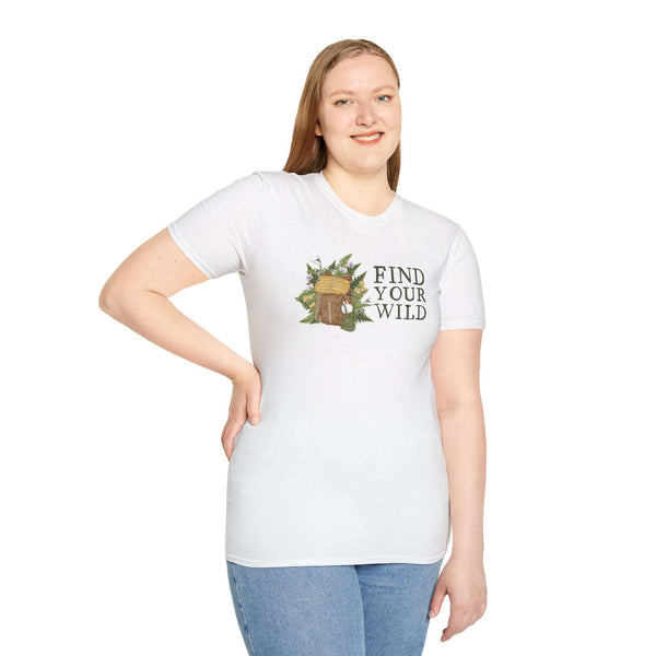 Model wearing 'Find Your Wild' softstyle t-shirt featuring backpack and fern design, perfect for outdoor enthusiasts.