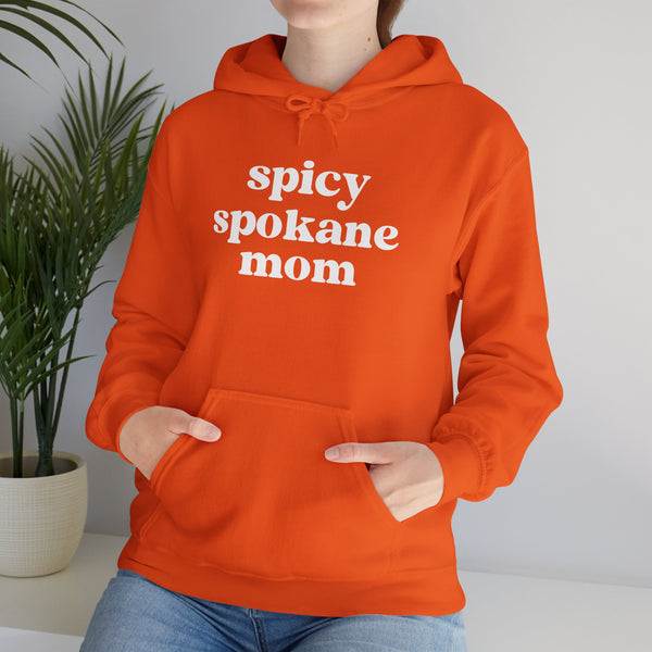 Spicy Spokane Mom cozy hoodie in vibrant orange, perfect for stylish Spokane moms who love adventure.